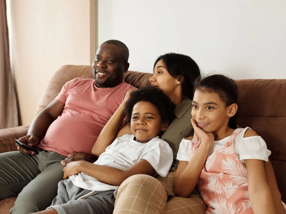 A family relaxing on the couch together