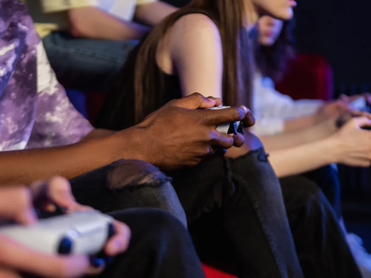 A person streaming on a large screen